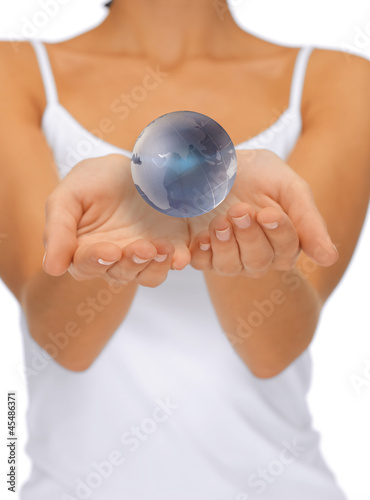 Photo: woman hands holding earth globe woman hands holding earth globe