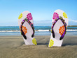 Flip-flops in the black volcanic sand of Tenerife island, Canari