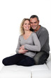 Couple hugging on sofa