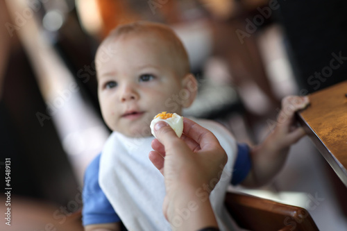 Photo: Toddler eating boiled egg Toddler eating boiled egg
