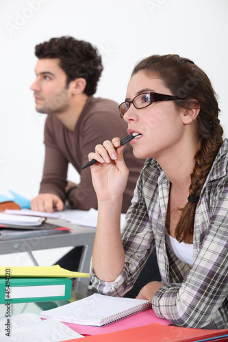 Photo: Two students concentrating in class Two students concentrating in class