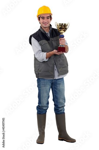 Photo: Builder holding trophy Builder holding trophy