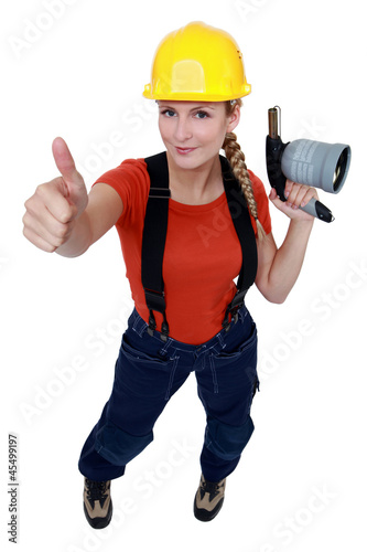 Photo: Woman holding blow-torch Woman holding blow-torch