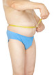 Fat man holding a measurement tape