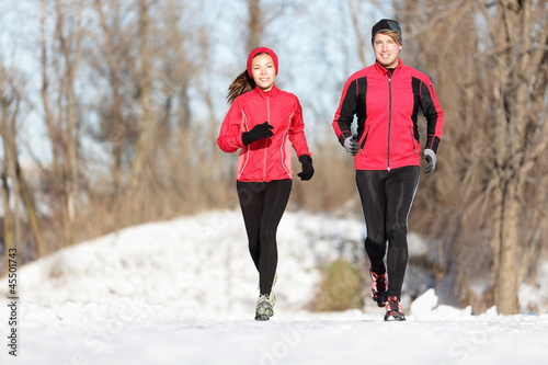 Photo: Sport couple running in winter Sport couple running in winter