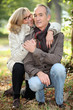 Mature couple walking in the woods