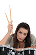 female musician posing with drums