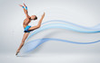 Young woman in gymnast suit posing