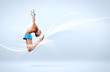 Young woman in gymnast suit posing