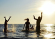 Photo: Silhouettes of people jumping in ocean Silhouettes of people jumping in ocean
