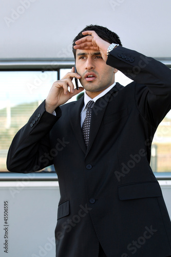 Photo: Disappointed man on the phone Disappointed man on the phone