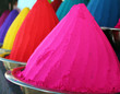 Piles and mounds of colorful dye powders for holi festival & oth