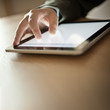 Photo: Person Using Modern Tablet Device Person Using Modern Tablet Device