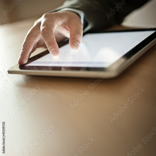 Photo: Person Using Modern Tablet Device Person Using Modern Tablet Device