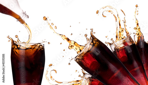 Photo: Fresh coke background with splash Fresh coke background with splash