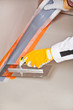 worker apply hydro insulation tape around the wall and floor