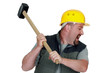 angry craftsman holding a hammer