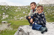 Foto: Portrait of two brothers outdoors in the mountains. Dolomites Portrait of two brothers outdoors in the mountains. Dolomites