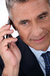 Mature businessman with a cellphone