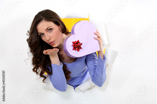 Photo: Woman with a heart shaped box of chocolates Woman with a heart shaped box of chocolates