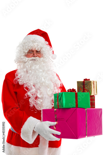 Photo: Santa Claus holding presents. Santa Claus holding presents.