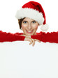 Women with santa hat presenting white message board