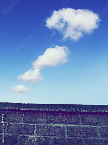 Photo: clouds over wall clouds over wall