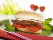 Cheeseburger with tomatoes and basil