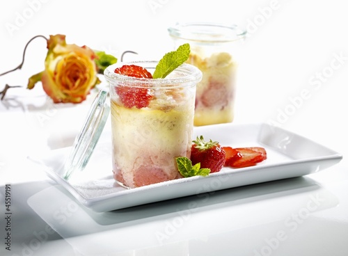 Photo: Cheese cake with strawberries in jars Cheese cake with strawberries in jars