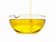 Oil Pouring into a Bowl