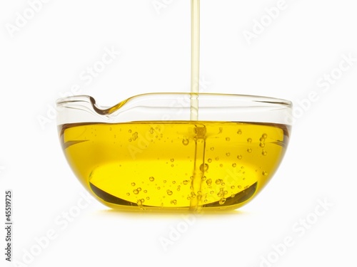 Photo: Oil Pouring into a Bowl Oil Pouring into a Bowl
