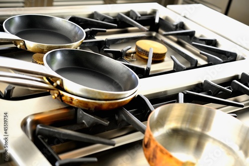 Photo: Various pots on a gas cooker Various pots on a gas cooker