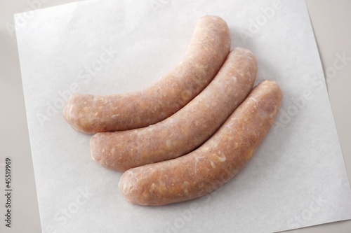 Photo: Three Buffalo Style Chicken Sausages on Butcher's Paper Three Buffalo Style Chicken Sausages on Butcher's Paper