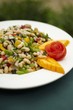 Bowl of White Bean Salad with Papaya Garnish