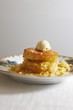 Cornbread Rounds with Honey Butter on a Plate