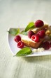 Piece of Pound Cake with Fresh Raspberries and Pineapple Sage