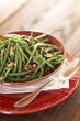 Serving Bowl of Green Beans with Marcona Almonds and Cranberries; Spoon