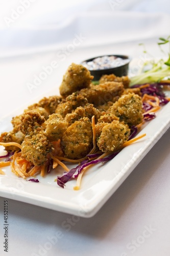 Photo: Fried Shrimp Appetizer on a Plate with Shredded Carrots and Cabbage Fried Shrimp Appetizer on a Plate with Shredded Carrots and Cabbage