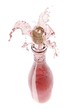 Rose wine spraying out of a bottle