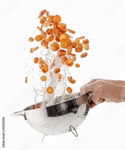 Photo: Sliced carrots being washed Sliced carrots being washed