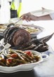 Roast beef with olives, bean salad and potatoes au gratin