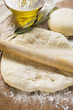Rolled out & ball of dough, rolling pin, olive oil & branch