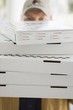 Several pizzas being delivered