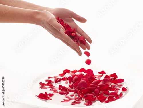 Photo: Bathing hands in a bowl of water with rose petals Bathing hands in a bowl of water with rose petals