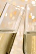 Glasses of sparkling wine with twinkling lights