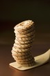 A stack on biscuit rings on a spatula