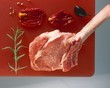 Beef chop with rosemary, dried tomatoes, olive
