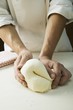 Kneading pizza dough