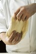 Kneading pizza dough