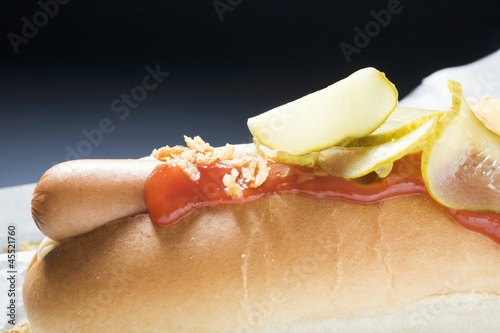 Photo: Hot dog with ketchup and gherkins (detail) Hot dog with ketchup and gherkins (detail)
